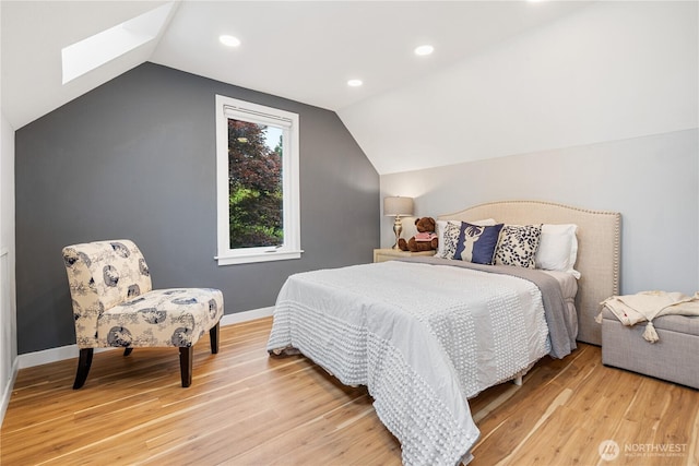 6026 35th Ave NE, Seattle, WA 98115 - bedroom with lofted ceiling, a skylight, light wood-style floors, recessed lighting, and baseboards