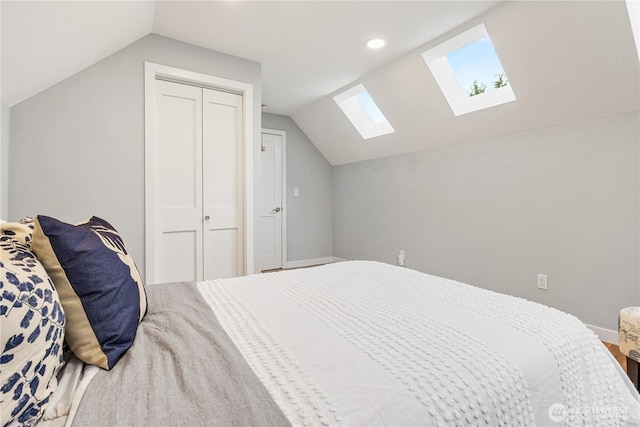 6026 35th Ave NE, Seattle, WA 98115 - bedroom featuring a skylight, vaulted ceiling, a closet, recessed lighting, and baseboards