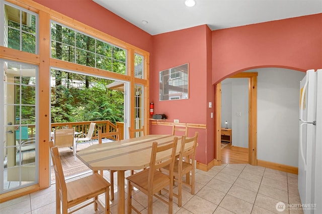 7117 Rainier Way, Deming, WA 98244 - dining room featuring arched walkways, light tile patterned floors, baseboards, and recessed lighting