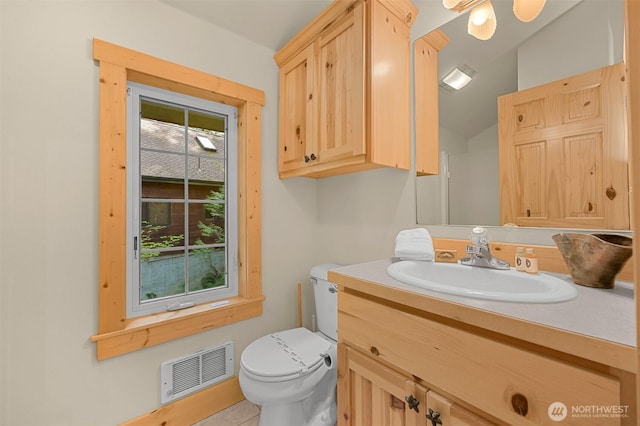 7117 Rainier Way, Deming, WA 98244 - bathroom with toilet, vanity, and tile patterned floors