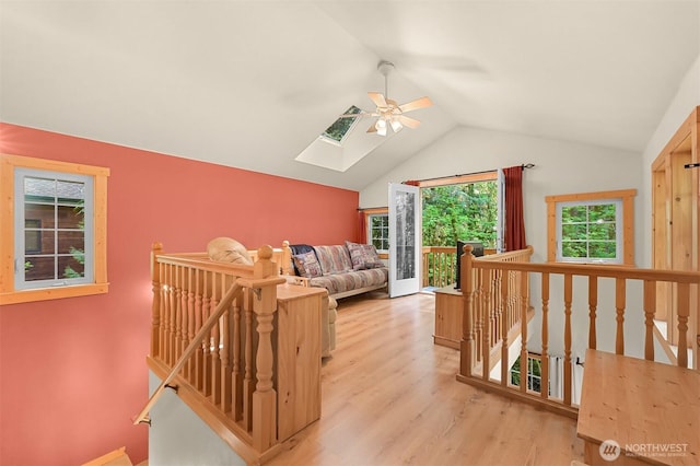 7117 Rainier Way, Deming, WA 98244 - hall featuring an upstairs landing, a skylight, light wood-type flooring, and vaulted ceiling