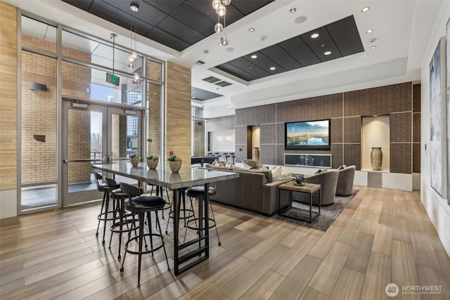 building lobby featuring a towering ceiling and recessed lighting