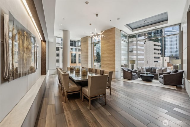 dining area featuring plenty of natural light, wood finished floors, and recessed lighting