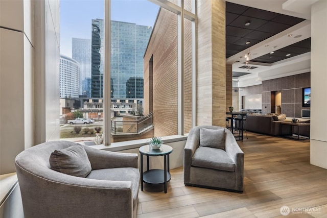 lobby with a view of city and a wall of windows