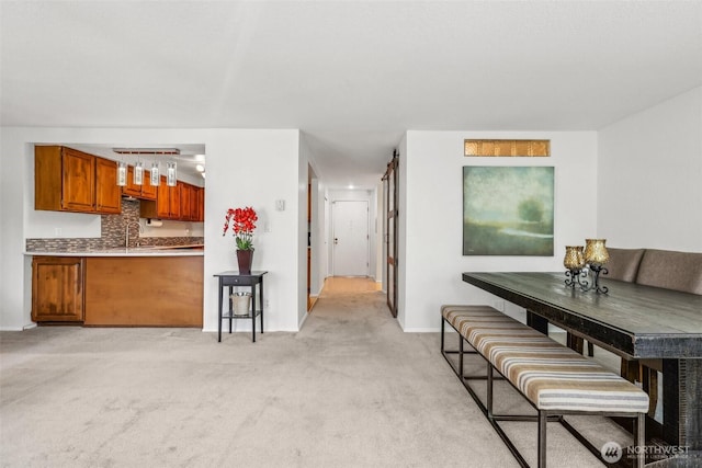132 N 132nd Unit 202, Seattle, WA 98133 - dining area featuring light carpet and baseboards