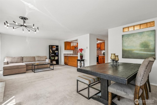 132 N 132nd Unit 202, Seattle, WA 98133 - dining area with a chandelier and light colored carpet