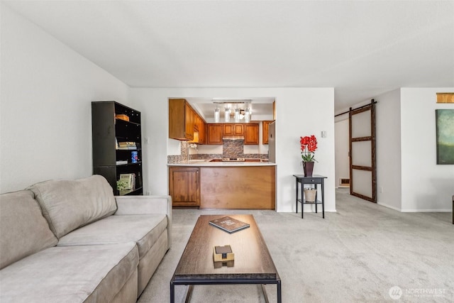132 N 132nd Unit 202, Seattle, WA 98133 - living area with light colored carpet, a barn door, and baseboards