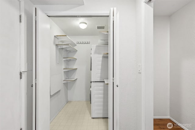 132 N 132nd Unit 202, Seattle, WA 98133 - walk in closet featuring washer / dryer