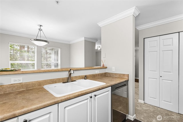 33020 10th Ave SW Unit Y304, Federal Way, WA 98023 - kitchen featuring dishwasher, a sink, crown molding, white cabinets, and carpet flooring