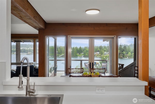 131 N Bay Ln Unit 4, Port Ludlow, WA 98365 - kitchen with a water view, french doors, and a sink