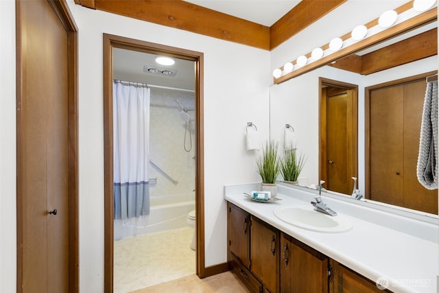 131 N Bay Ln Unit 4, Port Ludlow, WA 98365 - bathroom featuring vanity, toilet, shower / tub combo, and baseboards