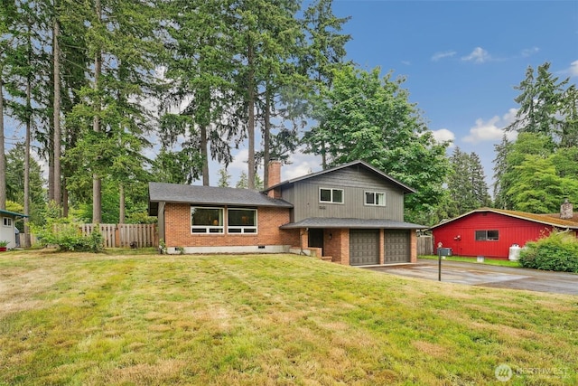 3512 Frances Dr SE, Lacey, WA 98503 - tri-level home with brick siding, a chimney, an attached garage, and driveway