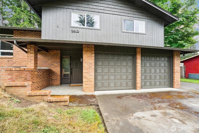 3512 Frances Dr SE, Lacey, WA 98503 - view of front of property featuring a garage, brick siding, and driveway