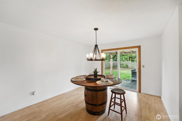 3512 Frances Dr SE, Lacey, WA 98503 - dining area featuring light wood-style floors, a chandelier, and baseboards