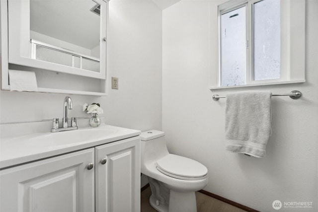 3512 Frances Dr SE, Lacey, WA 98503 - half bath featuring toilet, vanity, and wood finished floors