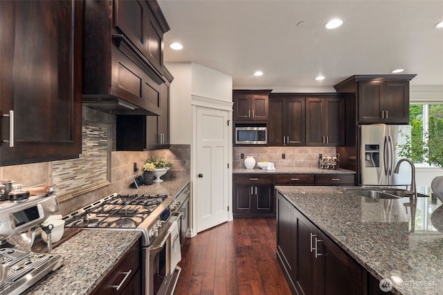2512 Taylor Dr, Everett, WA 98203 - kitchen featuring stainless steel appliances, dark stone counters, recessed lighting, dark brown cabinets, and dark wood-style floors