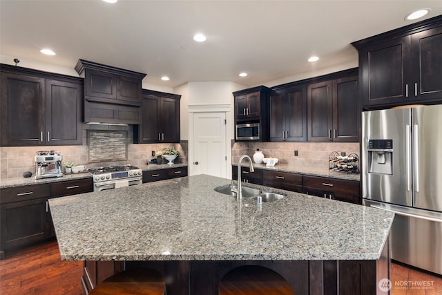 2512 Taylor Dr, Everett, WA 98203 - kitchen with stainless steel appliances, a breakfast bar, recessed lighting, and light stone counters