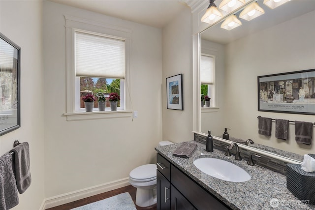 2512 Taylor Dr, Everett, WA 98203 - bathroom with wood finished floors, vanity, and plenty of natural light
