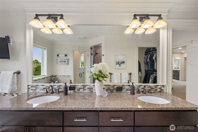 2512 Taylor Dr, Everett, WA 98203 - bathroom featuring decorative backsplash, double vanity, ornamental molding, and a chandelier