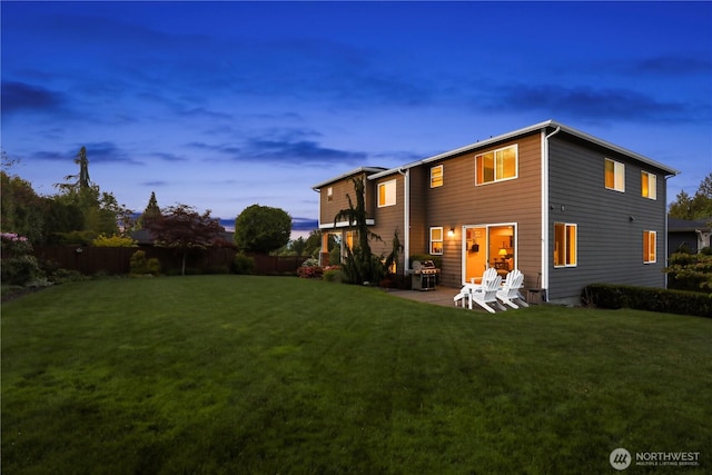 2512 Taylor Dr, Everett, WA 98203 - back of house at dusk with a patio