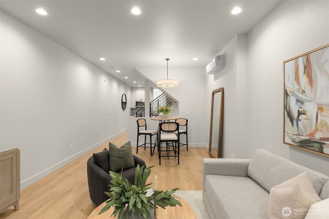 1108C 34th Ave, Seattle, WA 98122 - living area featuring recessed lighting, light wood-style flooring, a wall mounted air conditioner, and baseboards