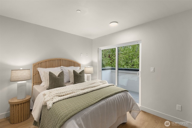 1108C 34th Ave, Seattle, WA 98122 - bedroom featuring baseboards, access to exterior, and light wood finished floors
