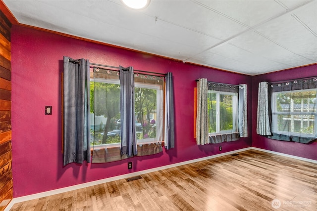 7311 Chambers Creek Rd W Unit 37, University Place, WA 98467 - spare room featuring healthy amount of natural light, wood finished floors, and baseboards