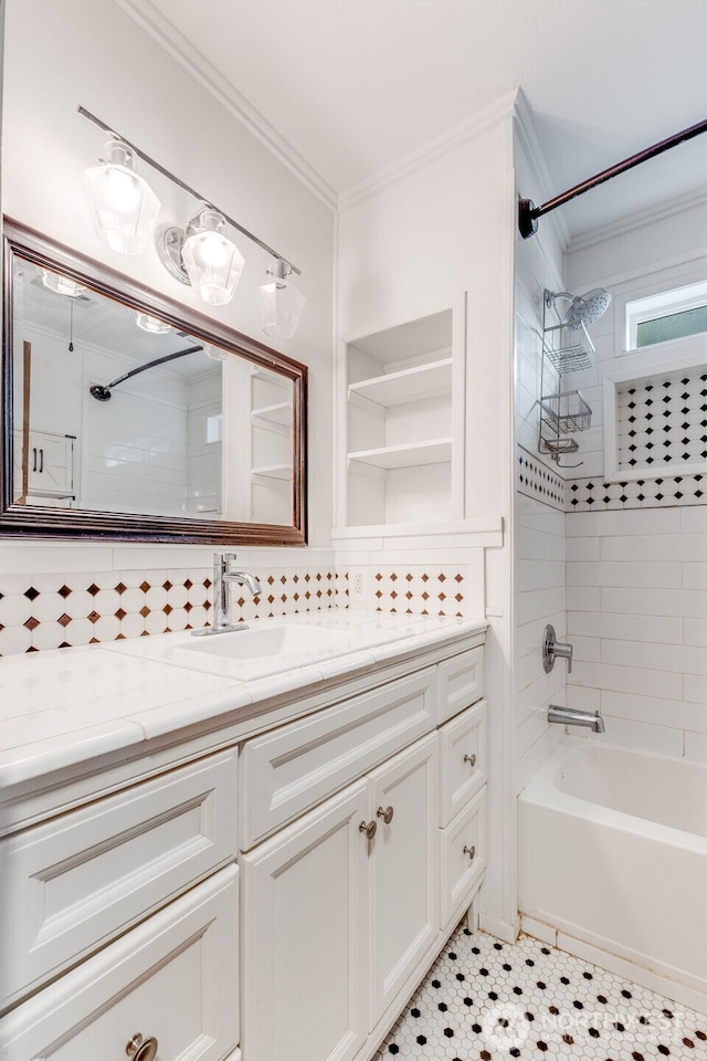 7311 Chambers Creek Rd W Unit 37, University Place, WA 98467 - bathroom featuring crown molding, vanity, washtub / shower combination, and decorative backsplash