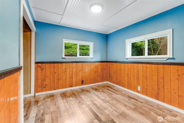 7311 Chambers Creek Rd W Unit 37, University Place, WA 98467 - spare room featuring wooden walls, wainscoting, and wood finished floors