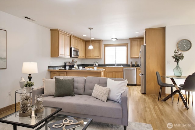 8515 Stone Ave N Unit A & B, Seattle, WA 98103 - living room featuring light wood finished floors and recessed lighting