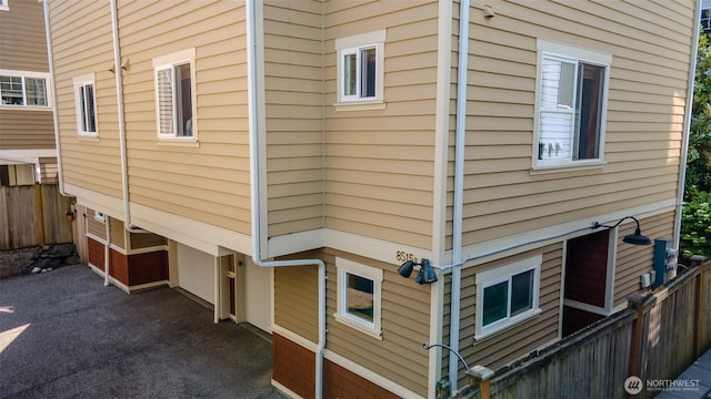 8515 Stone Ave N Unit A & B, Seattle, WA 98103 - view of home's exterior featuring fence and an attached garage