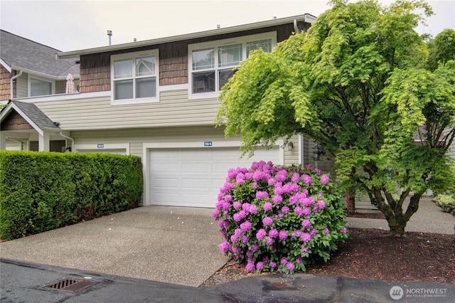 1422 Digby Pl Unit 104, Mount Vernon, WA 98274 - view of front of house with concrete driveway and a garage