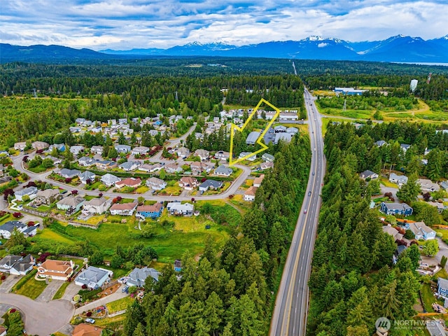 7819 Amethyst Loop NW, Silverdale, WA 98383 - view of property location featuring a forest, a mountain backdrop, and nearby suburban area