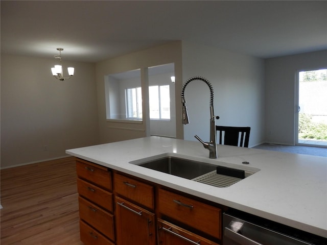 7819 Amethyst Loop NW, Silverdale, WA 98383 - kitchen featuring a sink, dishwashing machine, light countertops, and a chandelier