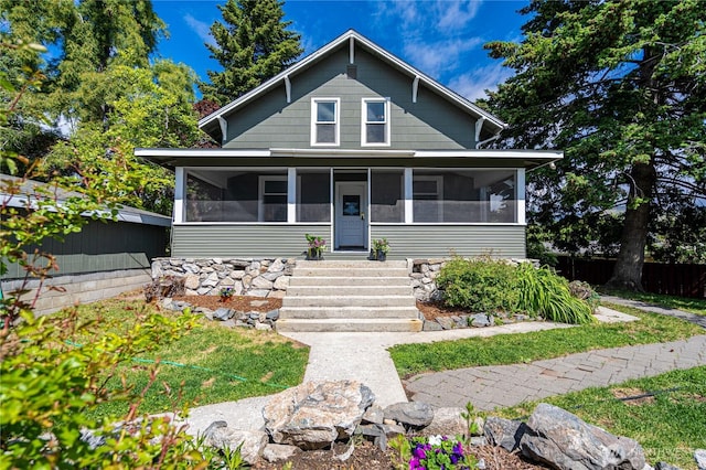 595 Division St, Manson, WA 98831 - bungalow-style house featuring a sunroom and fence
