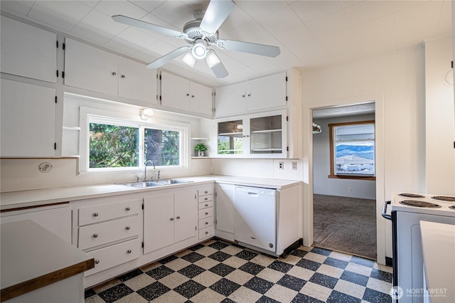 595 Division St, Manson, WA 98831 - kitchen featuring white appliances, a sink, light flooring, open shelves, and white cabinetry