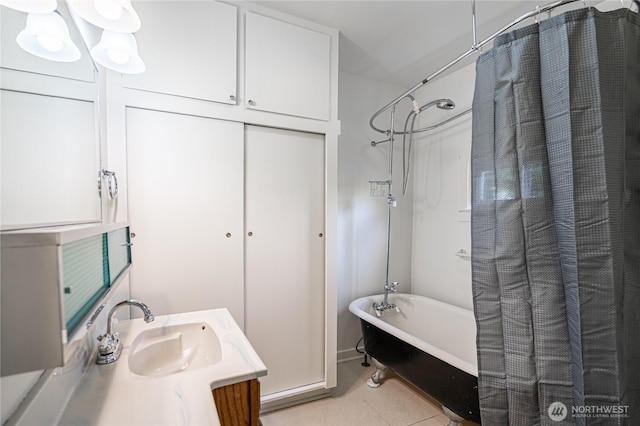595 Division St, Manson, WA 98831 - full bath with vanity, tile patterned flooring, and shower / bath combo