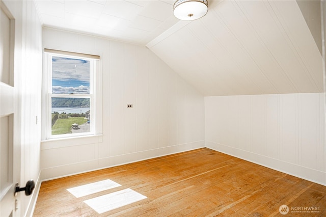 595 Division St, Manson, WA 98831 - additional living space with light wood finished floors, vaulted ceiling, and baseboards