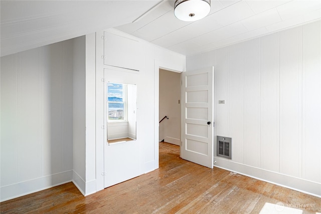 595 Division St, Manson, WA 98831 - spare room with light wood finished floors, baseboards, and a decorative wall