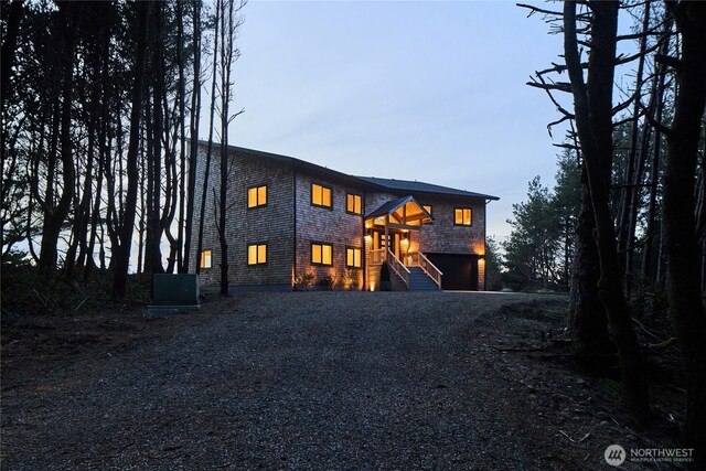 27208 J Ln, Ocean Park, WA 98640 - view of front of house featuring driveway, stairs, and central air condition unit