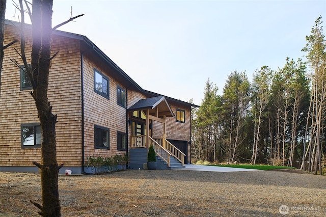 27208 J Ln, Ocean Park, WA 98640 - rear view of house featuring driveway and an attached garage