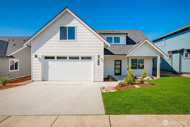 2818 Hazelwood Dr, Blaine, WA 98230 - view of front facade with concrete driveway, a front yard, roof with shingles, and a garage