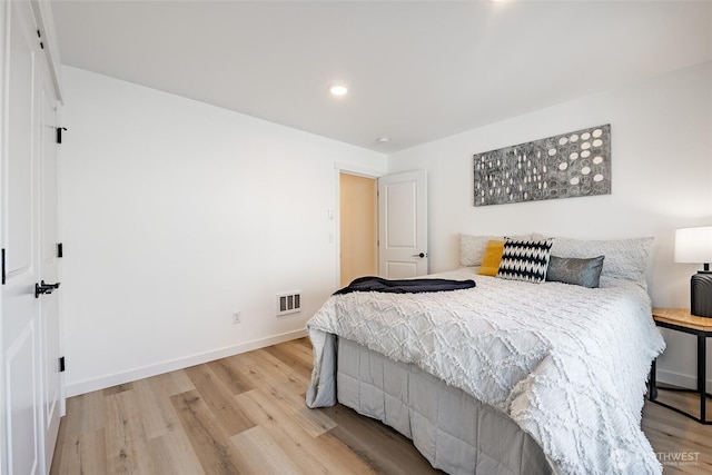 2818 Hazelwood Dr, Blaine, WA 98230 - bedroom with light wood finished floors, baseboards, and recessed lighting