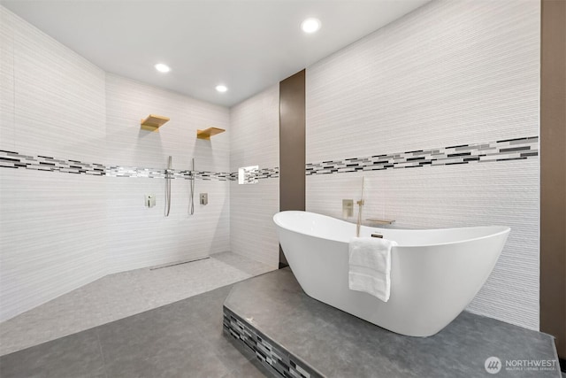 5496 Grandview Rd, Blaine, WA 98230 - full bath featuring a soaking tub, a walk in shower, recessed lighting, tile patterned floors, and tile walls