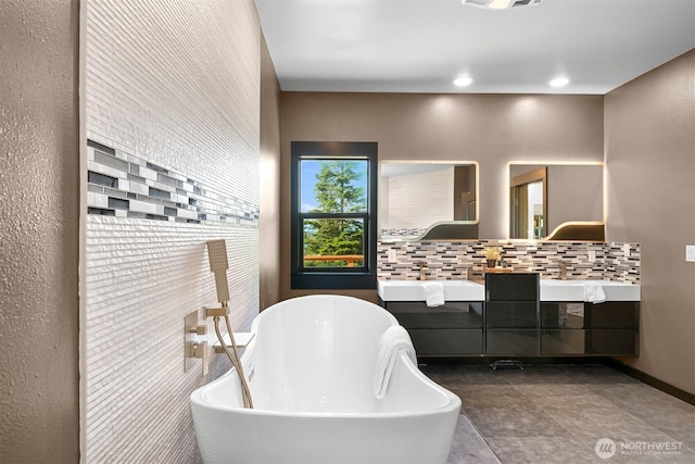 5496 Grandview Rd, Blaine, WA 98230 - full bathroom featuring double vanity, a soaking tub, and decorative backsplash