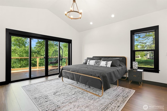 5496 Grandview Rd, Blaine, WA 98230 - bedroom featuring access to exterior, multiple windows, lofted ceiling, a chandelier, and wood finished floors