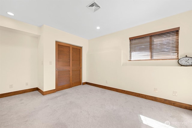 5496 Grandview Rd, Blaine, WA 98230 - unfurnished bedroom featuring light colored carpet, baseboards, a closet, and recessed lighting