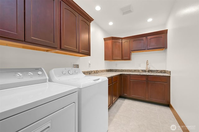 5496 Grandview Rd, Blaine, WA 98230 - washroom with washing machine and dryer, cabinet space, light tile patterned flooring, and recessed lighting