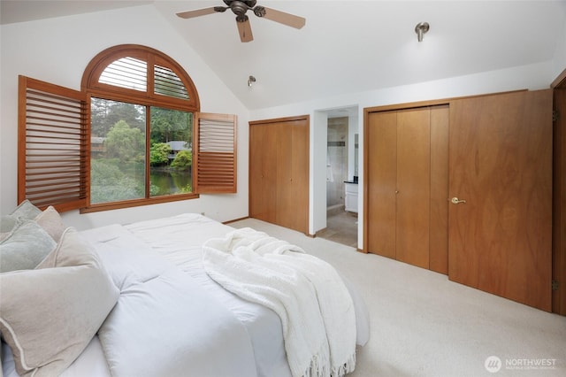 11423 NE 104th St, Kirkland, WA 98033 - bedroom with multiple closets, light colored carpet, ceiling fan, and high vaulted ceiling