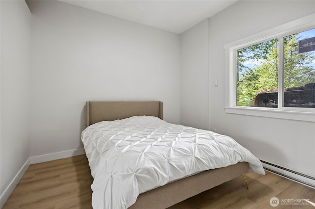 50 Lake Louise Dr, Bellingham, WA 98229 - bedroom with baseboard heating, wood finished floors, and baseboards